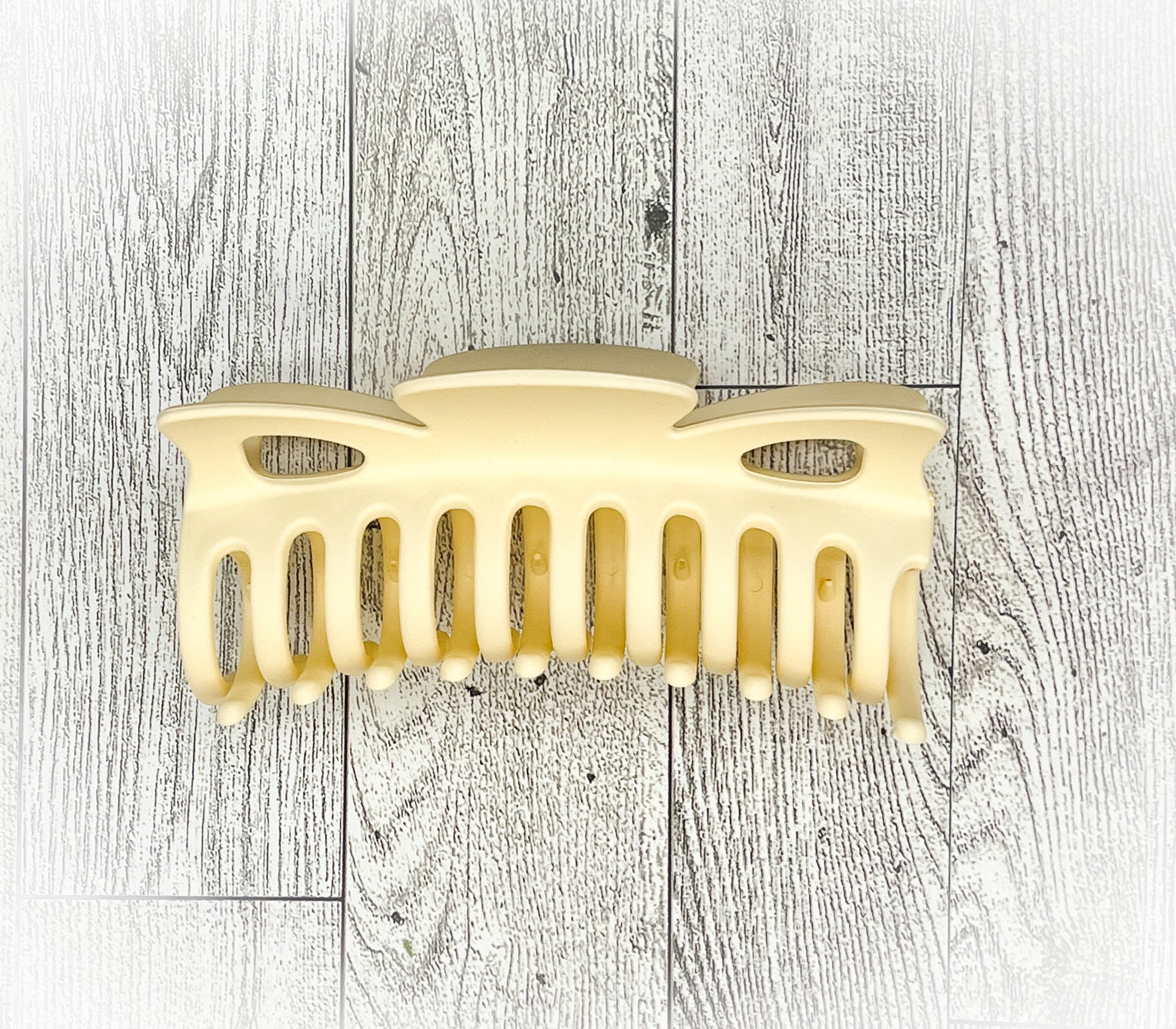 Matte Cream Hair Claw - Classic Bow shape - 4.5 inches in length. Great for Braids, twists, long hair, thick hair, and coarse hair.