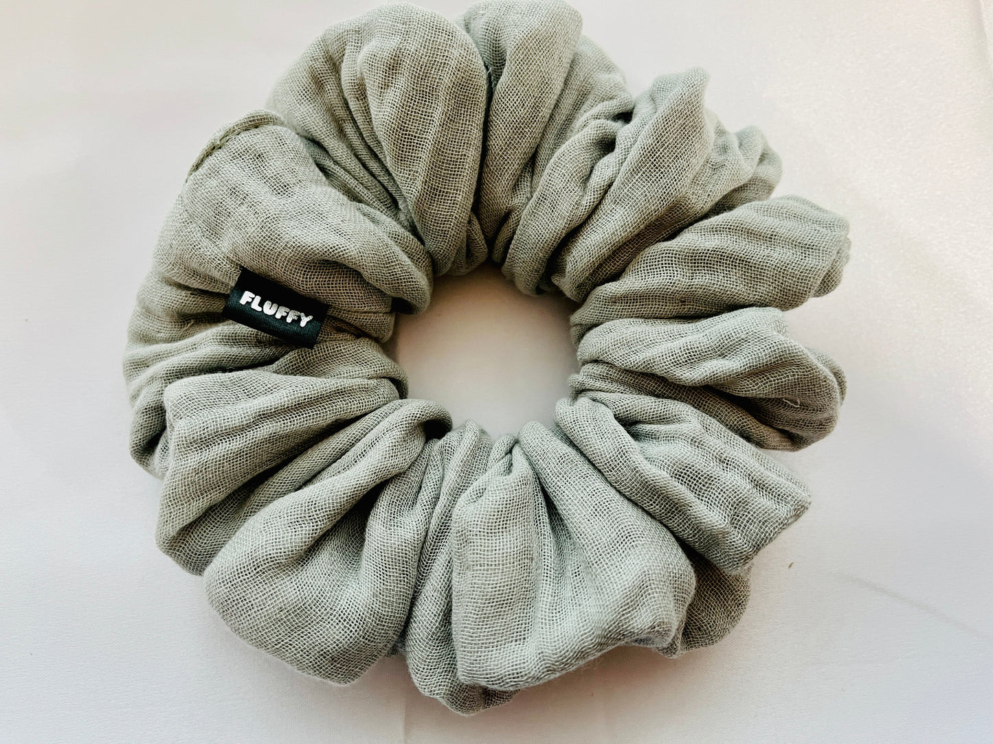 You are seeing our cotton scrunchies in 3 sizes.  The sizes of our cotton scrunchies  are Large, Medium and Mini.  Simply select the size you want in the drop down menu and add them to the card.   Our cotton scrunchies are perfect for all hair types and every person. We have multiple colors and sizes available