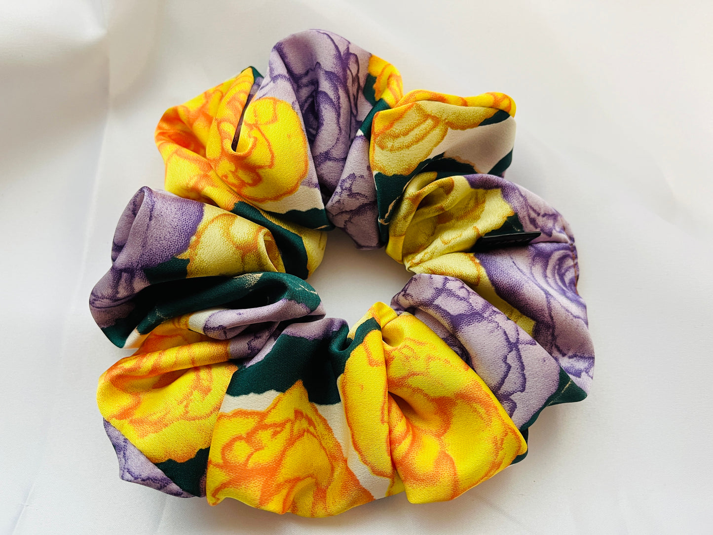 You are seeing our satin scrunchies in 3 sizes.. The sizes of our Satin Scrunchies are Large, Medium and Mini. Simply select the size you want in the drop down menu and add them to the card. Our Satin Scrunchies are perfect for all hair types and every person. We have multiple colors and sizes available