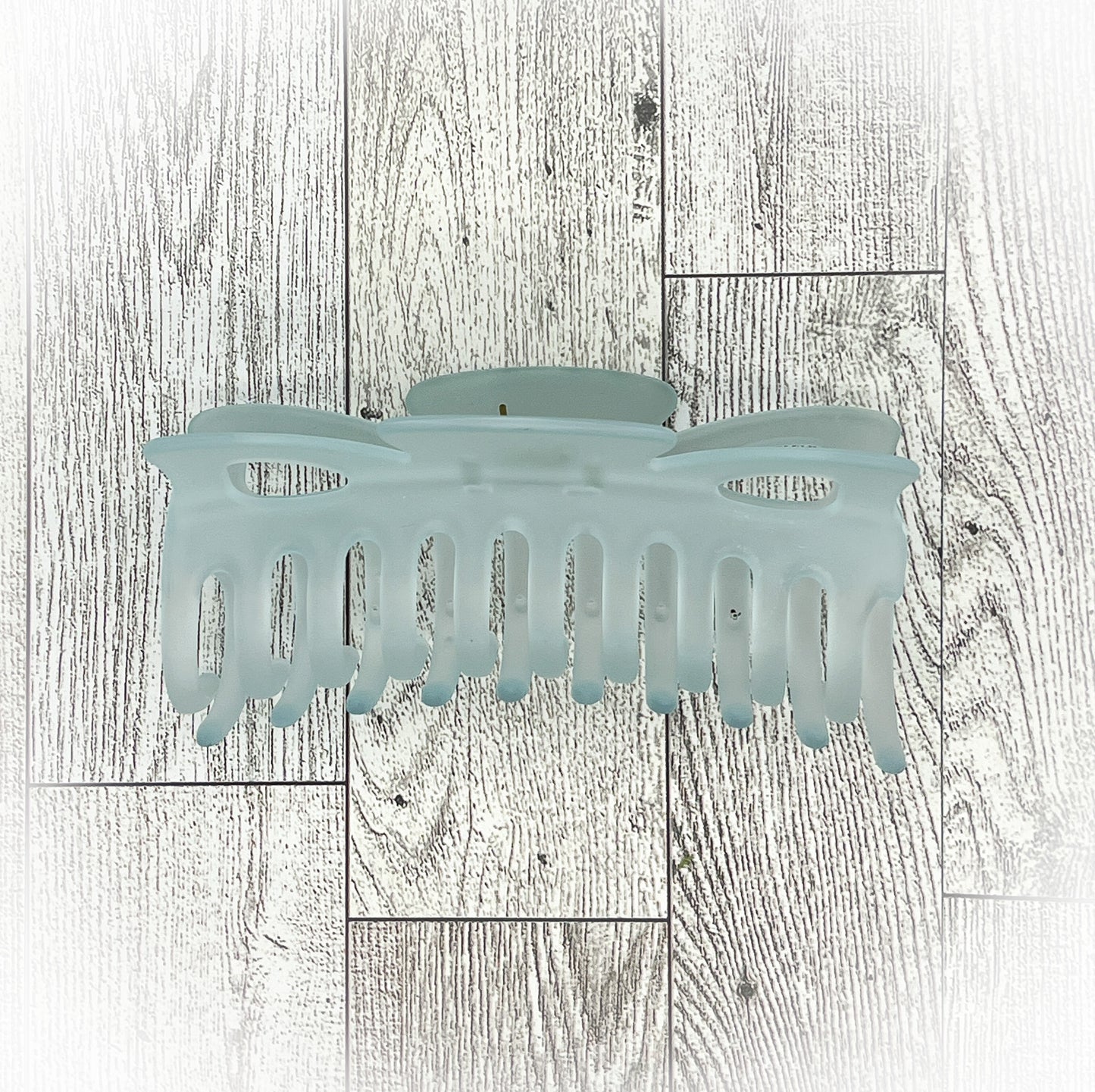 Frosted Blue Hair Claw - Classic Bow shape - 4.5 inches in length. Great for Braids, twists, long hair, thick hair, and coarse hair.