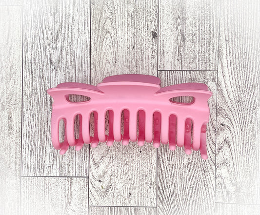 Matte Pink Hair Claw - Classic Bow shape - 4.5 inches in length. Great for Braids, twists, long hair, thick hair, and coarse hair.