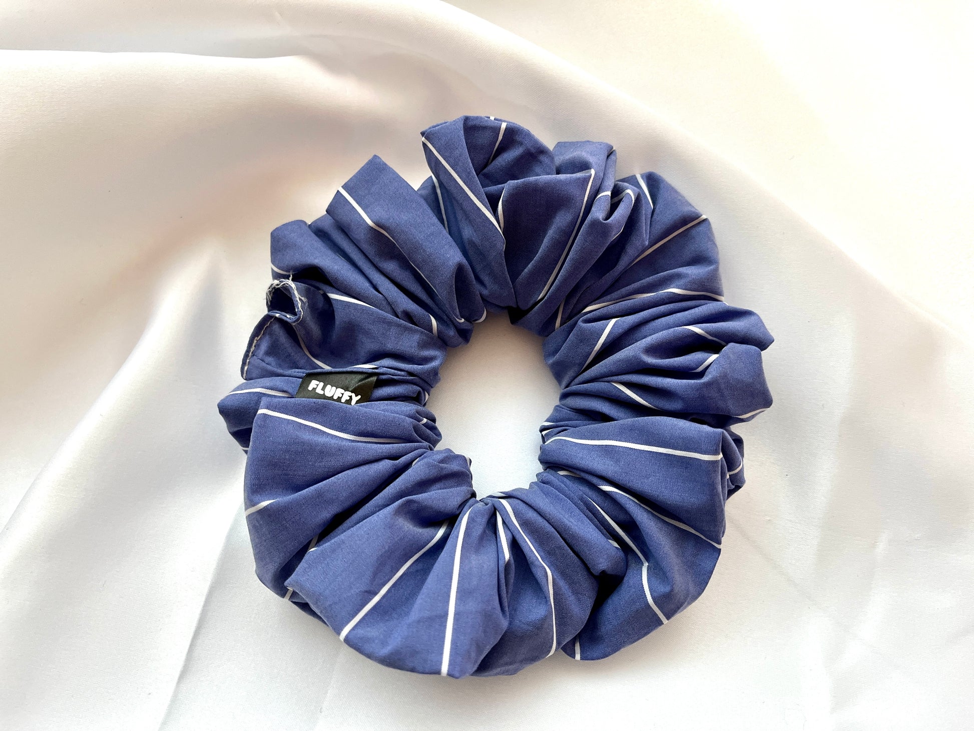 The Ultimate Sleek Pinstripe Fluffy Scrunchie .  The sizes of our cotton scrunchies  are Large, Medium and Mini.  Simply select the size you want in the drop down menu and add them to the card.   Our cotton scrunchies are perfect for all hair types and every person. We have multiple colors and sizes available